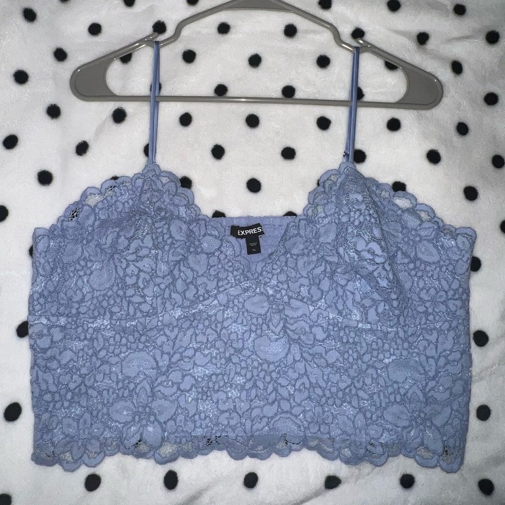 Cutesy baby blue cami with spaghetti straps.